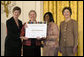 Laura Bush along with Mary Chute, Acting Director, Institute of Museums and Library Services, left, presents the 2005 National Awards for Museum and Library Services awards to St Paul Public Library Director, Kathleen Flynn, and Community Representative, Regina Harris, during a ceremony at the White House January 30, 2006. The Institute of Museum and Library Services’ National Awards for Museum and Library Service honor outstanding museums and libraries that demonstrate an ongoing institutional commitment to public service. It is the nation’s highest honor for excellence in public service provided by these institutions. White House photo by Shealah Craighead