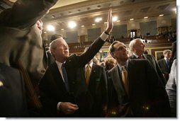 President George W. Bush waves toward the upper visitors gallery of the House Chamber following his State of the Union remarks Tuesday, Jan. 31, 2006 at the United States Capitol.  White House photo by Eric Draper