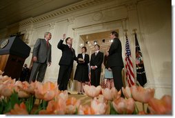 President George W. Bush, left, looks on during the swearing-in ceremony for U.S. Supreme Court Justice Samuel A. Alito, Tuesday, Feb. 1, 2006 in the East Room of the White House, sworn-in by U.S. Supreme Court Chief Justice John Roberts. Altio's wife, Martha-Ann, their son Phil and daughter, Laura, are seen center-background.  White House photo by Paul Morse