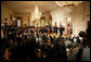 President George W. Bush looks on during the swearing-in ceremony for U.S. Supreme Court Justice Samuel A. Alito, Tuesday, Feb. 1, 2006 in the East Room of the White House, sworn-in by U.S. Supreme Court Chief Justice John Roberts. Altio's wife, Martha-Ann, their son Phil and daughter, Laura, are seen center-background. White House photo by Shealah Craighead
