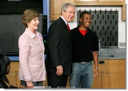 President George W. Bush and Mrs. Laura Bush greet student Michael Harrell during a visit with science and engineering students at the Yvonne A. Ewell Townview Magnet Center in Dallas, Texas, Friday, Feb. 3, 2006.  White House photo by Eric Draper