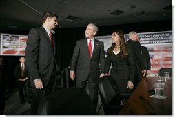 President George W. Bush speaks with participants Justin Sanchez, left, and Nicole Lopez after a panel on American competitiveness Friday, Feb. 3, 2006, at Intel Corporation in Rio Rancho, N.M.  White House photo by Eric Draper
