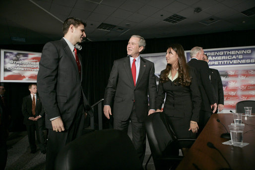 President George W. Bush speaks with participants Justin Sanchez, left, and Nicole Lopez after a panel on American competitiveness Friday, Feb. 3, 2006, at Intel Corporation in Rio Rancho, N.M. White House photo by Eric Draper