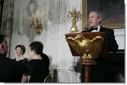 President George W. Bush addresses guests Monday evening, Feb. 6, 2006 in the State Dining Room at the White House to honor The Dance Theatre of Harlem.  White House photo by Kimberlee Hewitt