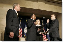 President George W. Bush participates in the swearing-in ceremony Monday, Feb. 6, 2006, for Ben Bernanke as Chairman of the Federal Reserve. Vice Chairman Roger W. Ferguson, Jr., administers the oath of office to Chairman as Mrs. Anna Bernanke, the Chairman's wife, holds the Bible.  White House photo by Kimberlee Hewitt
