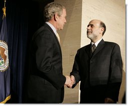 President George W. Bush shakes the hand of Ben Bernanke after he was sworn in Monday, Feb. 6, 2006, as Chairman of the Federal Reserve.  White House photo by Kimberlee Hewitt