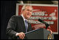 President George W. Bush addresses his remarks on the 2007 Budget and the Deficit Reduction Act of 2005, in a speech to the Business and Industry Association of New Hampshire, Wednesday, Feb. 8, 2006 in Manchester, N.H.  White House photo by Paul Morse