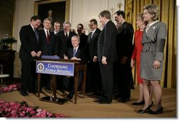 President George W. Bush is joined by legislators Wednesday, Feb. 8, 2006 at the signing ceremony for S. 1932, The Deficit Reduction Act of 2005, in the East Room of the White House.  White House photo by Eric Draper