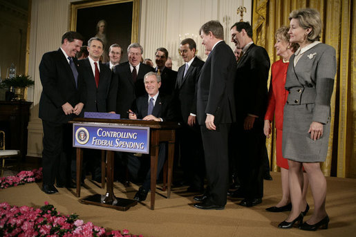 President George W. Bush is joined by legislators Wednesday, Feb. 8, 2006 at the signing ceremony for S. 1932, The Deficit Reduction Act of 2005, in the East Room of the White House. White House photo by Eric Draper