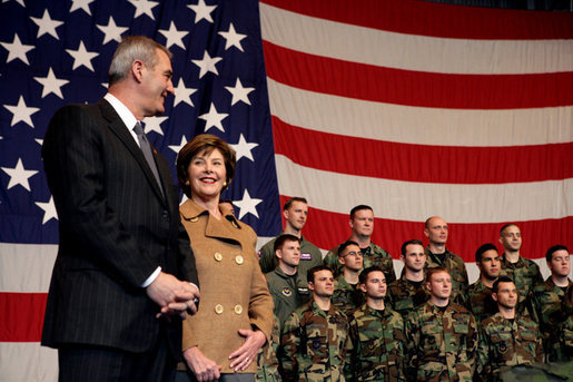 Laura Bush stands with U.S Ambassador to Italy Ron Spogli before speaking with troops during a visit to Aviano Air Base, in Aviano, Italy, Friday, Feb. 10, 2006. White House photo by Shealah Craighead