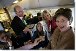 Laura Bush talks with members of the press aboard her plane en route to Turin, Italy, Friday, Feb. 10, 2006.  White House photo by Shealah Craighead