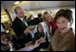 Laura Bush talks with members of the press aboard her plane en route to Turin, Italy, Friday, Feb. 10, 2006. White House photo by Shealah Craighead