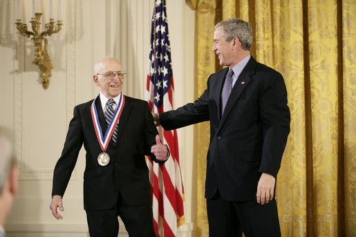 President George W. Bush presents a National Medal of Technology, Monday, Feb. 13, 2006 to Ralph H. Baer of Manchester, N.H., during ceremonies in the East Room of the White House. Baer was honored for his groundbreaking and pioneering creation, development and commercialization of interactive video games. White House photo by Eric Draper