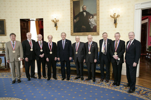 President George W. Bush and the Dr. John Marburger, far-right, director of the White House Office of Science and Technology, pose with the recipients of National Medal of Science, Monday, Feb. 13, of the White House. From left to right are Dr. Dennis P. Sullivan, Dr. Phillip A. Sharp, Dr. Robert N. Clayton, Dr. Stephen J. Lippard, Dr. Kenneth J. Arrow, Dr. Norman E. Borlaug, Dr. Edwin N. Lightfoot and Dr. Thomas E. Starzl. White House photo by Eric Draper