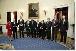 President George W. Bush and the U.S. Commerce Sec. Carlos Gutierrez, far-right, pose with the recipients of National Medal Technology, Monday, Feb. 13, of the White House. From left to right are Padmasree Warrior of Motorola, Nicholas M. Donofrio of IBM, Henry L. Nordhoff of Gen-Probe Inc., Roger L. Easton of RoBarCo, Ralph H. Baer of Manchester, N.H., Chrissie England and George Lucas of Industrial Light and Magic, and Mark. C. Pigott of PACCAR Inc.  White House photo by Eric Draper