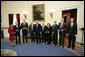 President George W. Bush and the U.S. Commerce Sec. Carlos Gutierrez, far-right, pose with the recipients of National Medal Technology, Monday, Feb. 13, of the White House. From left to right are Padmasree Warrior of Motorola, Nicholas M. Donofrio of IBM, Henry L. Nordhoff of Gen-Probe Inc., Roger L. Easton of RoBarCo, Ralph H. Baer of Manchester, N.H., Chrissie England and George Lucas of Industrial Light and Magic, and Mark. C. Pigott of PACCAR Inc. White House photo by Eric Draper