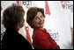 Laura Bush sits with Lois Ingland, a heart disease survivor, during an event at the Carolinas Medical Center Wednesday, Feb. 15, 2006, in Charlotte, NC. The four key risk factors of women with heart disease are smoking, obesity, high blood pressure, and high cholesterol. White House photo by Shealah Craighead