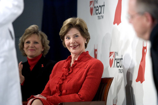 Laura Bush sits with Lois Ingland, a heart disease survivor, during an event at the Carolinas Medical Center Wednesday, Feb. 15, 2006, in Charlotte, NC. Despite having none of the risk factors of heart disease, Lois, a mother of four, suffered a heart attack when she was 36 years old. White House photo by Shealah Craighead