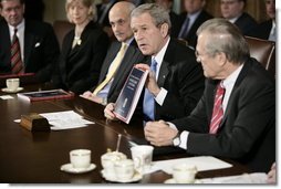 President George W. Bush holds a copy of the newly released report, The Federal Response to Hurricane Katrina: Lessons Learned, while talking to reporters at a Cabinet meeting Thursday, Feb. 23, 2006 at the White House. The report reviews the federal response to Katrina and makes recommendations about how to better respond in the future.  White House photo by Eric Draper