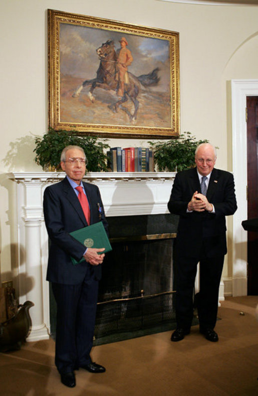 Vice President Dick Cheney applauds Lieutenant Bernard W. Bail, recipient of the Distinguished Service Cross, in the Roosevelt Room at the White House, Friday, February 24, 2006. The Vice President awarded the Distinguished Service Cross to Lt. Bail for his extraordinary acts of heroism during World War II and commended Lt. Bail for being a "brave citizen who elevated service to country above self interest." White House photo by David Bohrer