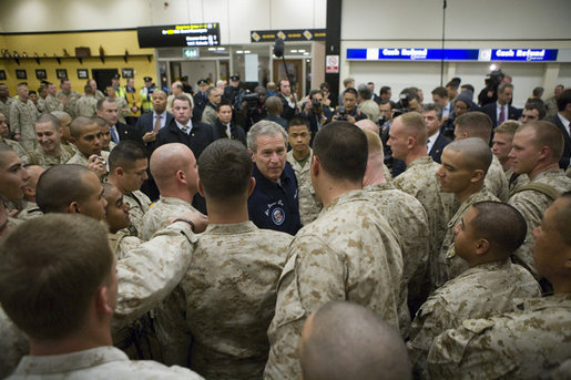 President George W. Bush meets with U.S. Marines headed to Iraq, during a stopover Tuesday evening, Feb. 28, 2006 at Shannon, Ireland's international airport terminal. President Bush visited with the Marines as part of his five-day visit to India and Pakistan. White House photo by Paul Morse