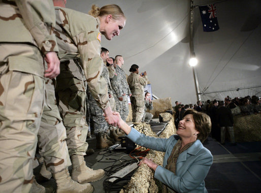 Mrs. Laura Bush greets U.S. and Coalition troops Wednesday, March 1, 2006, during a stopover at Bagram Air Base in Afghanistan, prior to the President and Mrs. Bush visiting India and Pakistan. White House photo by Eric Draper