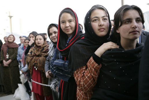 Women stand outside the U.S. Embassy in Kabul, Afghanistan Wednesday, March 1, 2006. President George W. Bush and Laura Bush made a surprise visit to the city and presided over a ceremonial ribbon-cutting at the embassy before continuing their trip to India. White House photo by Eric Draper