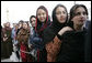 Women stand outside the U.S. Embassy in Kabul, Afghanistan Wednesday, March 1, 2006. President George W. Bush and Laura Bush made a surprise visit to the city and presided over a ceremonial ribbon-cutting at the embassy before continuing their trip to India. White House photo by Eric Draper