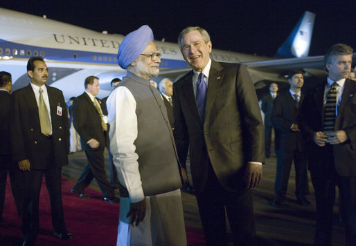 President George W. Bush is welcomed to India by Indian Prime Minister Manmohan Singh upon Air Force One's arrival Wednesday, March 1, 2006, at Indira Gandhi International Airport. The President and First Lady are scheduled to spend three days in the country before flying to Pakistan. White House photo by Eric Draper