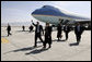 President George W. Bush gives the thumbs-up after Air Force One landed at Bagram Air Base near Kabul, Afghanistan Wednesday, March 1, 2006. The five-hour surprise visit included a meeting with Afghan President Karzai, a ceremonial ribbon-cutting at the U.S. Embassy, and a visit to the troops at Bagram. White House photo by Eric Draper