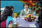 Mrs. Laura Bush listens to a question during an informal group discussion with teachers and students on her tour of Prayas, Thursday, March 2, 2006, in New Delhi, India. White House photo by Shealah Craighead
