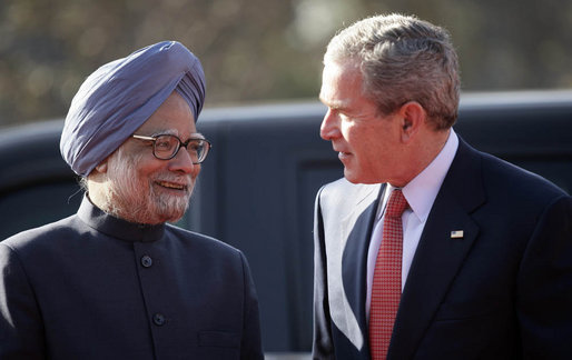 President George W. Bush is greeted by India's Prime Minister Manmohan Singh upon arrival Thursday, March 2, 2006, at the presidential residence in New Delhi. White House photo by Eric Draper