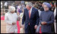 President George W. Bush listens to India's President A.P.J. Abdul Kalam as they walk the red carpet with Prime Minister Manmohan Singh during the arrival ceremony in New Delhi Thursday, March 2, 2006, welcoming the President and Mrs. Bush to India. White House photo by Eric Draper