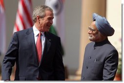 President George W. Bush smiles as he stands with India's Prime Minister Manmohan Singh during a press availability in New Delhi Thursday, March 2, 2006. The President told those in attendance that India and America "have built a strategic partnership based on common values," and thanked the Indian people and the Indian government "for supporting the new democracy in the neighborhood."  White House photo by Paul Morse