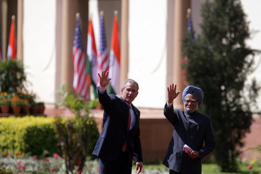 President George W. Bush and Prime Minister Manmohan Singh of India wave as they leave Mughal Garden at the Hyderabad House after a press availability in New Delhi Thursday, March 2, 2006. White House photo by Paul Morse