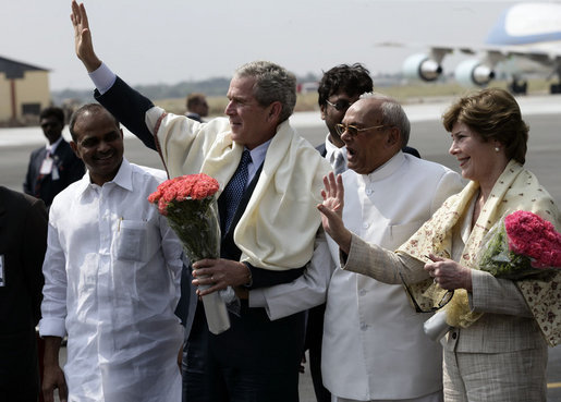President George W. Bush and Laura Bush wave as they prepare to depart Hyderabad Airport Landing Zone for a return flight to New Delhi. White House photo by Eric Draper