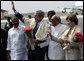 President George W. Bush and Laura Bush wave as they prepare to depart Hyderabad Airport Landing Zone for a return flight to New Delhi. White House photo by Eric Draper