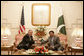 President George W. Bush is welcomed by Pakistan President Pervez Musharraf to Aiwan-e-Sadr in Islamabad, Pakistan, Saturday, March 4, 2006. White House photo by Eric Draper