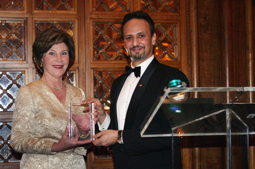 Mrs. Laura Bush is presented with an award by Kuwait Ambassador Al-Sabah, Tuesday evening, March 8, 2006 at the at "Bridges of Hope: Educating Children for a Better Future," The Kuwait-America Foundation's 2006 Benefit Dinner in Washington, in honor of her dedication to help improve the living conditions and education of children around the world. White House photo by Shealah Craighead