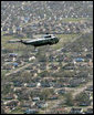 President George W. Bush in Marine One takes an aerial tour to view of the hurricane ravaged neighborhoods of New Orleans and their recovery progress, Wednesday, March 8, 2006. The President also took a walking tour in the lower 9th Ward of the city and inspected the reconstruction of a levee. White House photo by Eric Draper