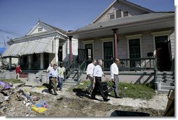 President George W. Bush views the destruction to homes and debris piles while touring the lower 9th Ward of New Orleans, Wednesday, March 8, 2006 with New Orleans Mayor Ray Nagin, right. White House photo by Eric Draper