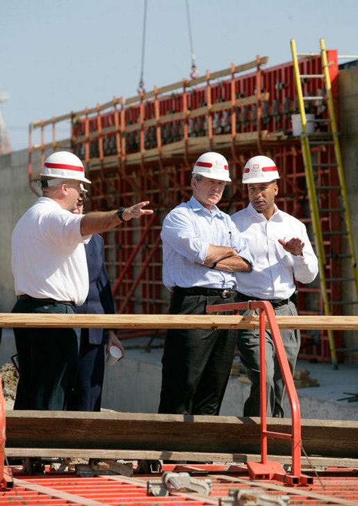 President George W. Bush and New Orleans Mayor Ray Nagin, right, view flood wall construction in the Industrial Levee Canal, Wednesday, March 8, 2006 in New Orleans, during a tour to view the clean up and reconstruction progress of New Orleans six-months after the city was devastated by Hurricane Katrina. White House photo by Eric Draper