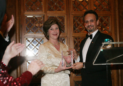 Mrs. Laura Bush is presented with an award by Kuwait Ambassador Al-Sabah, Tuesday evening, March 8, 2006 at the at "Bridges of Hope: Educating Children for a Better Future," The Kuwait-America Foundation's 2006 Benefit Dinner in Washington, in honor of her dedication to help improve the living conditions and education of children around the world. White House photo by Shealah Craighead