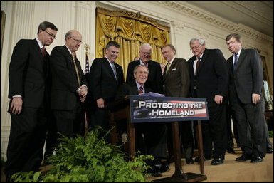 President George W. Bush is joined by House and Senate representatives as he signs H.R. 3199, USA Patriot Improvement and Reauthorization Act of 2005.