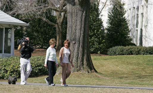 Mrs. Laura Bush takes a brisk walk with Barbara Harrison of WRC-TV (NBC 4) around the South Grounds of the White House Friday, March 10, 2006, during an interview given by Mrs. Harrison. The focus of the interview is to promote exercise and health awareness. White House photo by Shealah Craighead