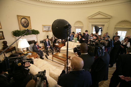 President George W. Bush and Peru's President Alejandro Toledo talk with reporters during their Oval Office visit, Friday, March 10, 2006 at the White House. White House photo by Eric Draper