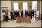 President George W. Bush and Mrs. Laura Bush meet Friday, March 10, 2006 in the Oval Office of the White House, with representatives from various organizations honored for their support the U.S. military. White House photo by Eric Draper