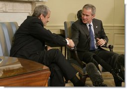 President George W. Bush and Prime Minister Mikulas Dzurinda of Slovakia, exchange handshakes during remarks in the Oval Office of the White House Monday, March 13, 2006. President Bush thanked the Prime Minister for his contributions to helping the young democracies in Afghanistan and Iraq succeed.  White House photo by Paul Morse