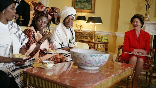Mrs. Laura Bush visits with representatives from the Mothers to Mothers-To-Be program of South Africa, Monday, March 13, 2006 in the Yellow Oval Room in the private residence at the White House. Mrs. Bush had earlier met with members of the program, who mentor and counsel mothers who come for prenatal care to clinics and find they are HIV-positive, on her visit to South Africa in July of 2005. From left to right are Babalwa Mbono, Aunt Manyongo "Kunene" Mosima Tantoh and Gloria Ncanywa. White House photo by Kimberlee Hewitt