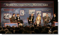 President George W. Bush participates in a Conversation on the Medicare Prescription Drug Benefit, Tuesday, March 14, 2006 at the Canandaigua Academy in Canandaigua, N.Y., with Dr. Mark McClellan and Diane Lawatsch, left, and Bob and Eleanor Wisnieff with Susan Wiber, right. White House photo by Kimberlee Hewitt